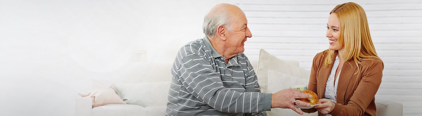Caregiver and senior client sharing a laugh
