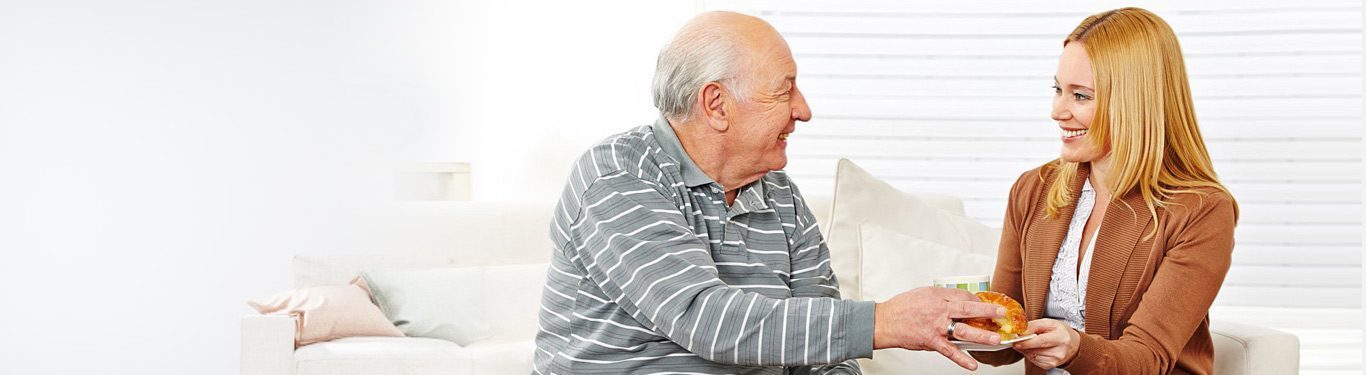 Caregiver sharing a warm moment with a senior client