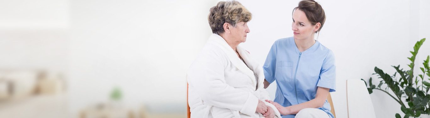 Caregiver assisting a senior client at home