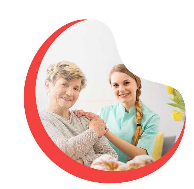 Caregiver holding hands with a senior client, both smiling